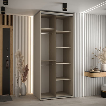 Modern interior with a tall beige wardrobe and decorative elements.