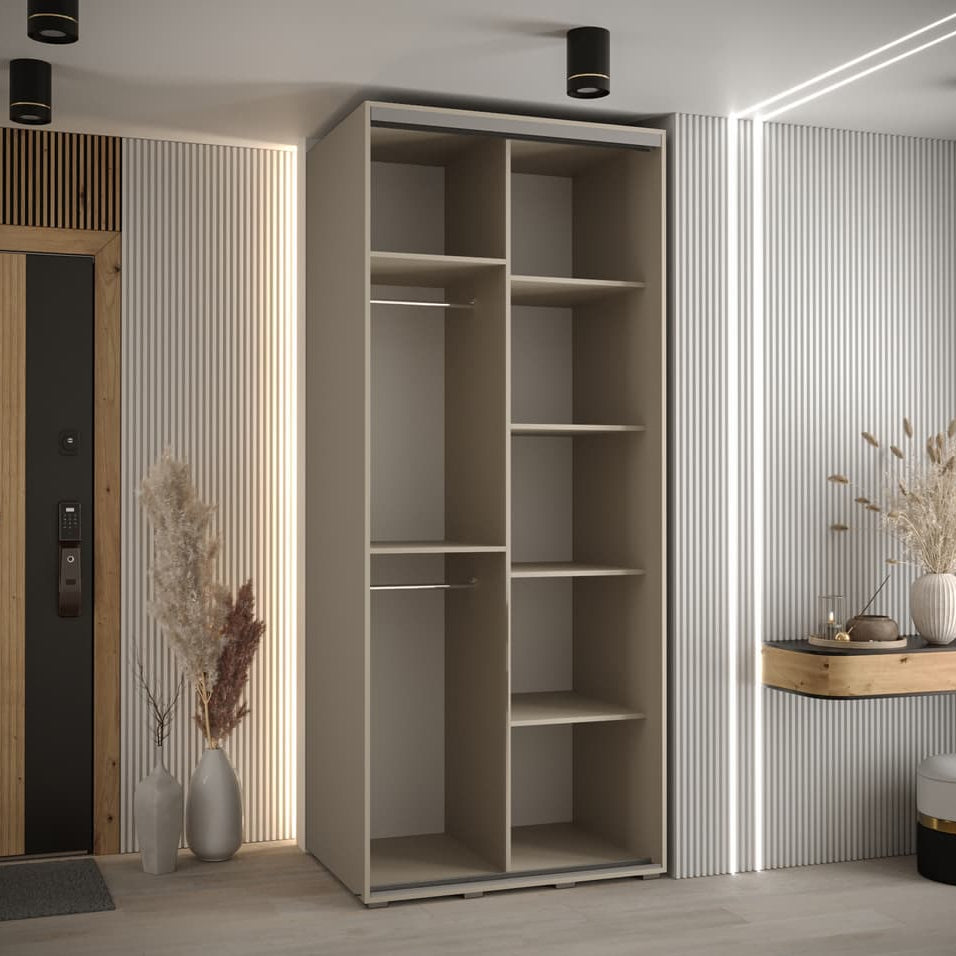 Modern interior with a tall beige wardrobe and decorative elements.
